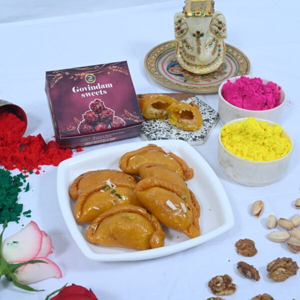 Traditional Gujiya filled with khoya and dry fruits.