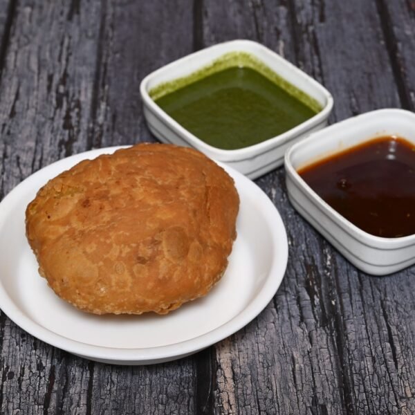 Crispy and golden Pyaz Kachori filled with spiced onion stuffing.