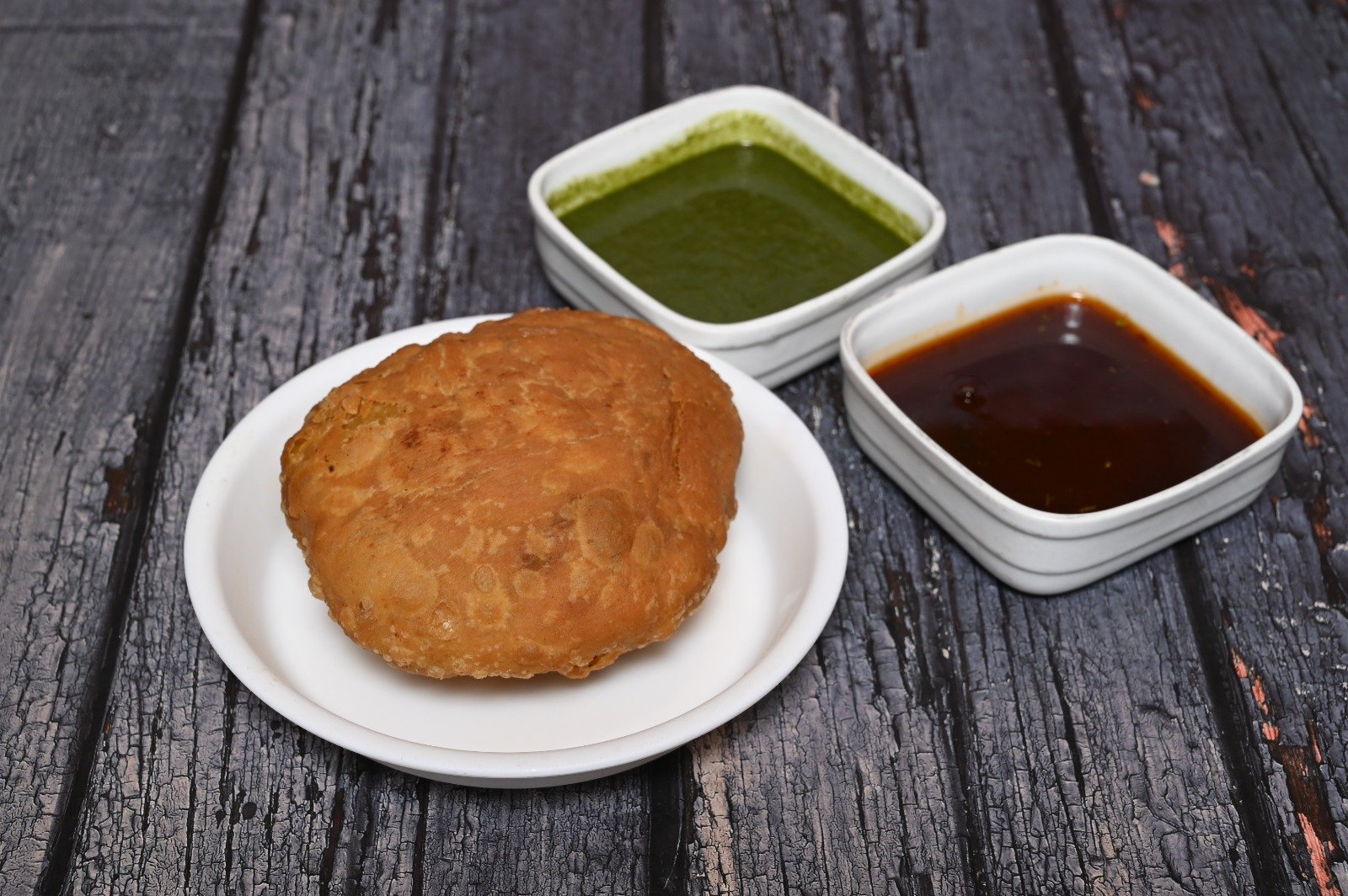 Crispy and golden Pyaz Kachori filled with spiced onion stuffing.