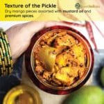 Bold Punjabi mango pickle showing whole spices and oil