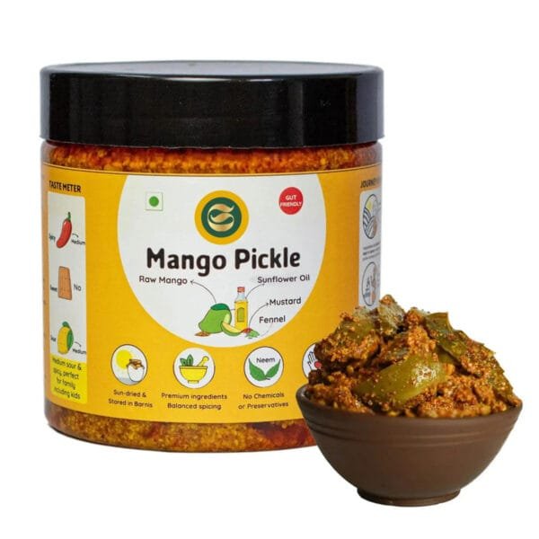 Glass jar of homemade mango pickle showing natural color